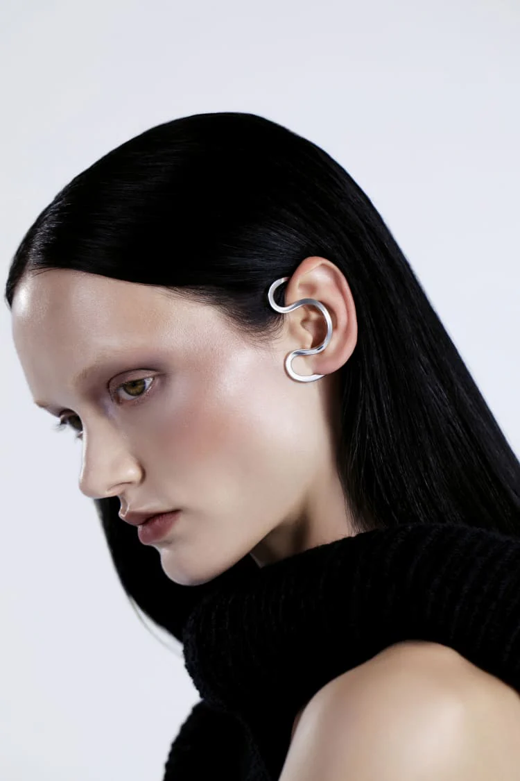 Silver ear cuff around the ear
