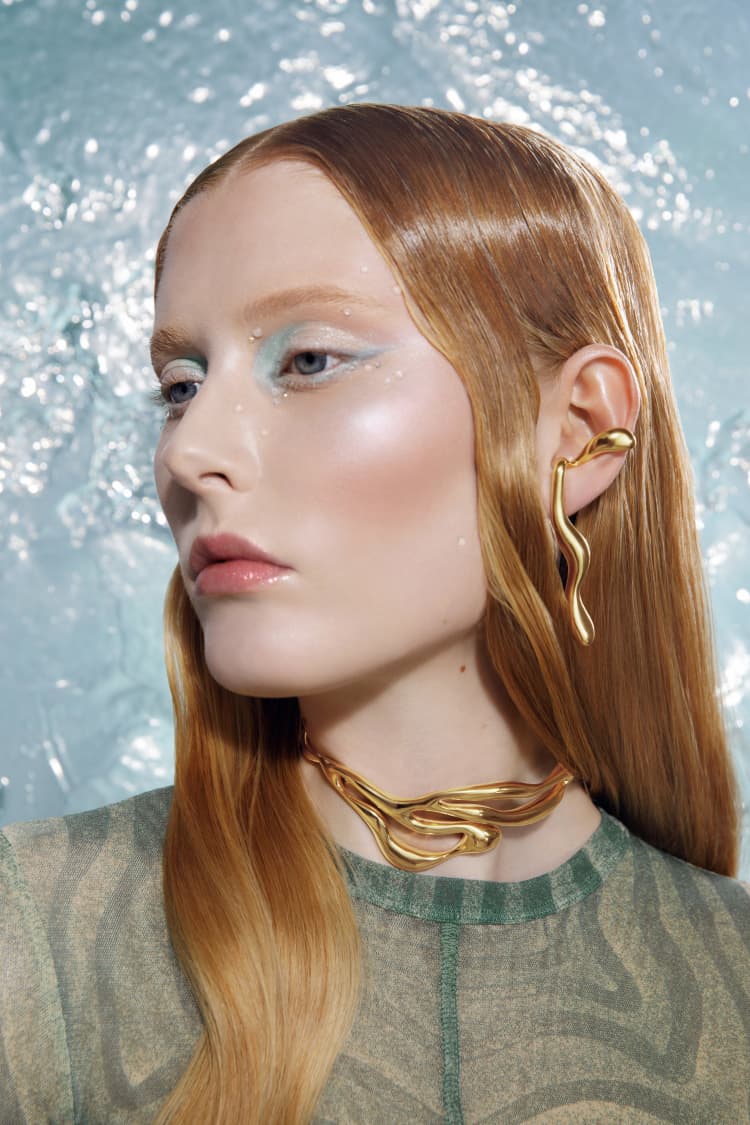 gold liquid earrings that hook around the ears - Image 3