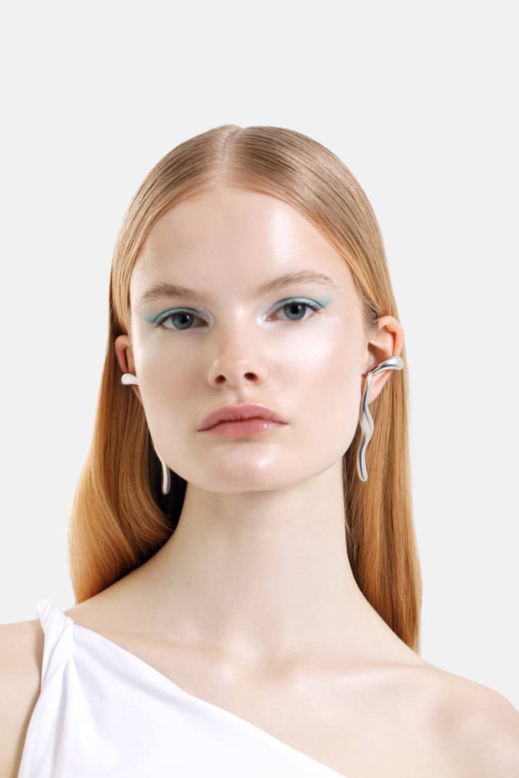 silver liquid earrings that hook around the ears